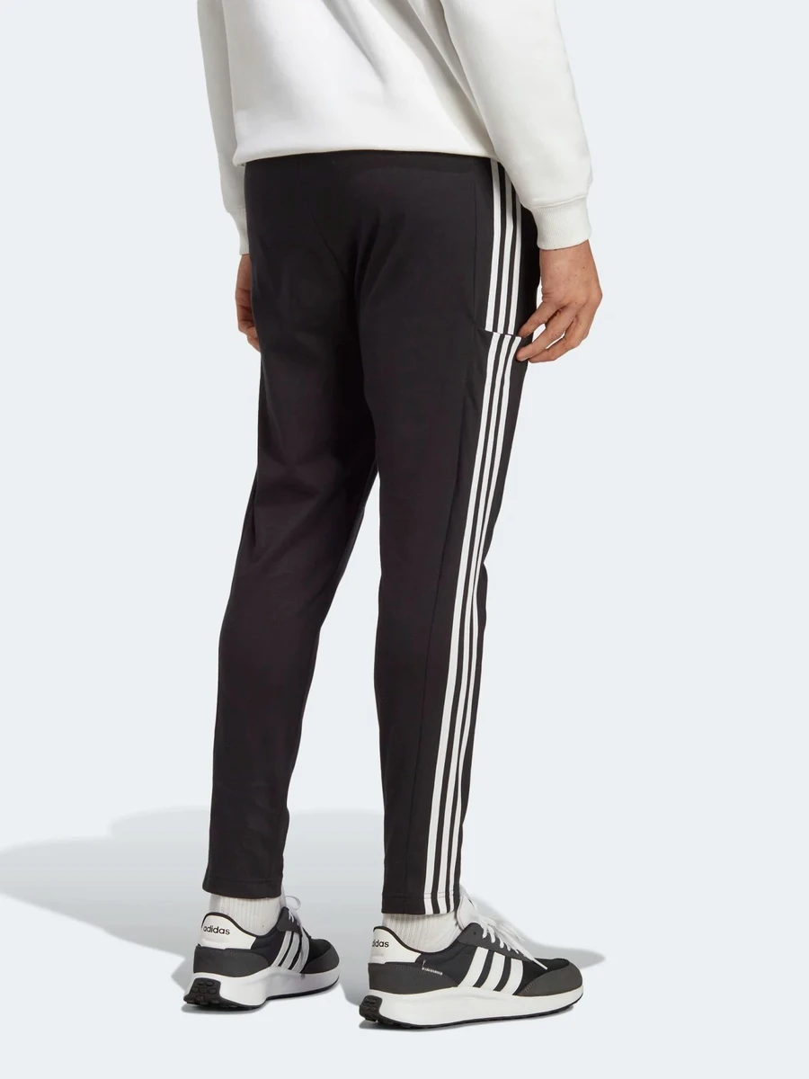 Adidas Брюки мужские ESSENTIALS SINGLE JERSEY TAPERED OPEN HEM 3-STRIPES PANTS