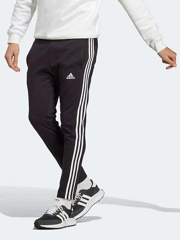 Adidas Брюки мужские ESSENTIALS SINGLE JERSEY TAPERED OPEN HEM 3-STRIPES PANTS