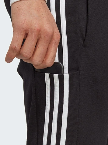 Adidas Брюки мужские ESSENTIALS SINGLE JERSEY TAPERED OPEN HEM 3-STRIPES PANTS